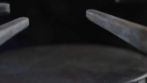 Super slow motion of a burning gas stove top Stock Footage 117626177