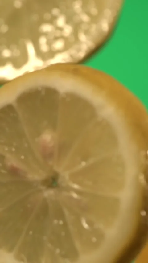 Super slow motion Capturing slowmotion sequences of lemon fragments drifting Stock Footage 326276113
