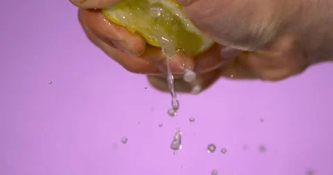 Super Slow Motion Caucasian Hand Squeezing Lemon For Cocktail Stock Footage 333427224