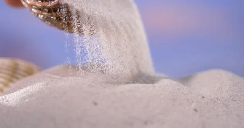 Super Slow Motion Caucasian Hand Pouring Shell Sand Stock Footage 335108966