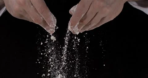 Super slow motion, Caucasian Hands Sifting Flour In Kitchen, Closeup Studio Shot Video stock 330751722