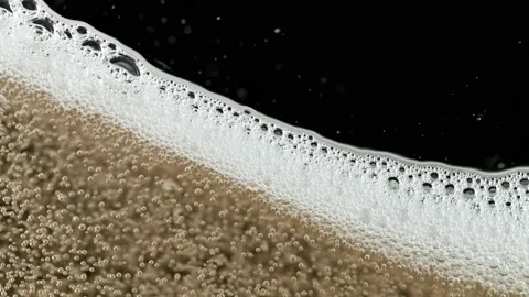 Super slow motion of champagne bubbles and foam texture. 스톡 동영상 159720082