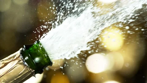 Super slow motion of Champagne explosion, opening champagne bottle closeup Stock Footage 144425796