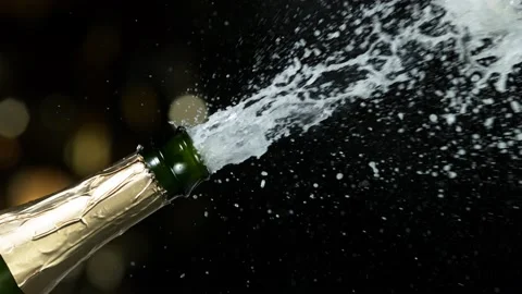 Super slow motion of Champagne explosion, opening champagne bottle closeup Stock Footage 144457307