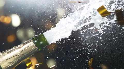 Super slow motion of Champagne explosion, opening champagne bottle closeup Stock Footage 144459437