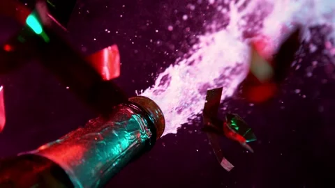 Super slow motion of Champagne explosion with falling confetti. Stock Footage 160776345