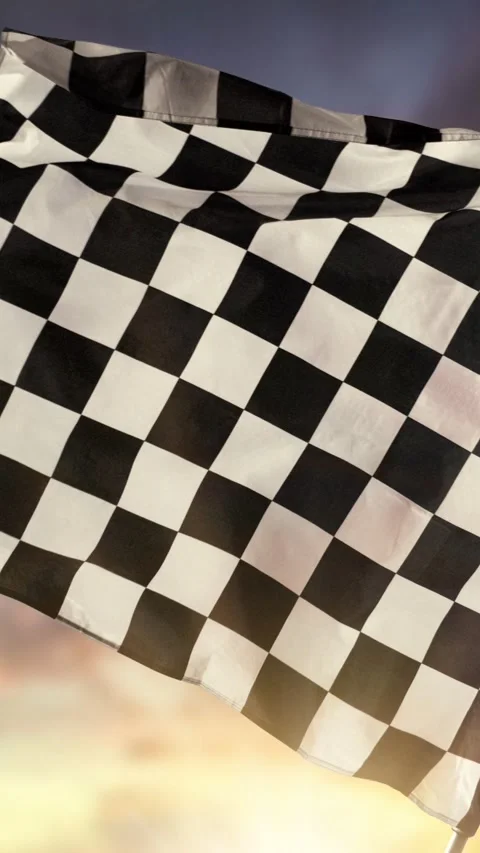 Super Slow Motion of Checkered Race Flag Waving Continuously in the Wind Stock Footage 295030298