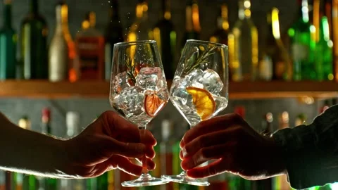 Super slow motion of cheering gin and tonic drinks in bar. Stock Footage 233249326