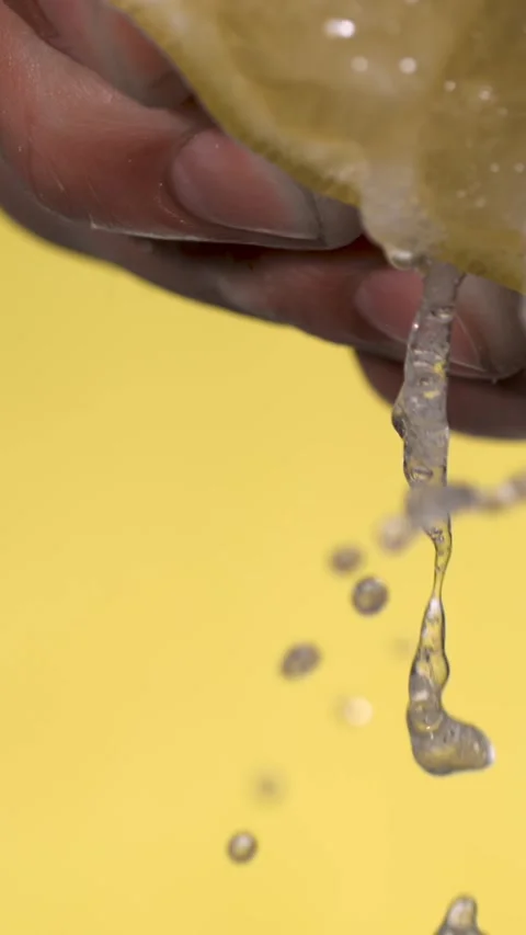 Super Slow Motion Chef Lemon Squeeze On Yellow  Stock Footage 333485175