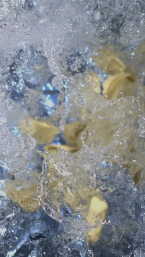 Super slow motion, Chef Plunges Tortellini Into Boiling Water Stock Footage 331233385