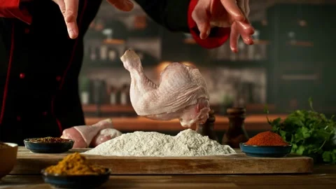Super Slow Motion of Chef Throwing Raw Chicken Legs into Flour. Stock Footage 301321655