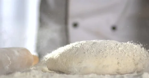 Super Slow motion chef throwing dough with flour explosion Stock Footage 332234909