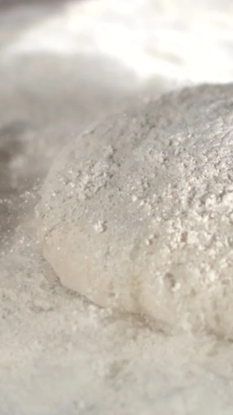 Super Slow motion chef throwing dough with flour explosion Stock Footage 332234956