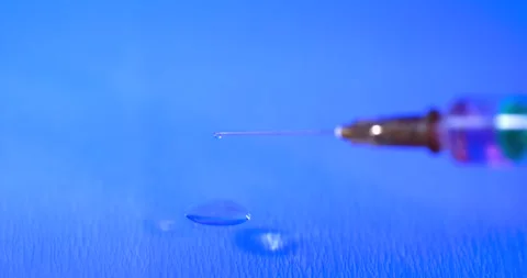 Super Slow Motion Clinician Tests Needle Droplet On Skin Surface  Stock Footage 333426629