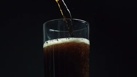 A super slow motion clip of cola being poured into a glass Stock Footage 87857247