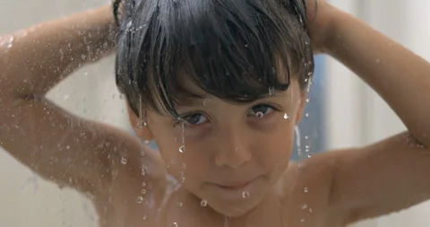 Super slow-motion clip of kid showering during bath time with droplets of w.. Stock Footage 250217501