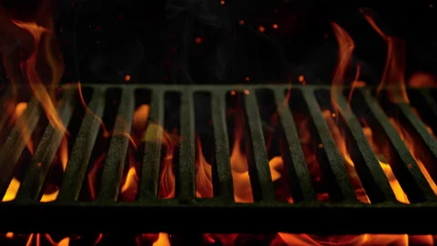 Super Slow Motion Close-Up of Hot Grill Grate with Flames and Glowing Embers at Vídeos de archivo 304418168