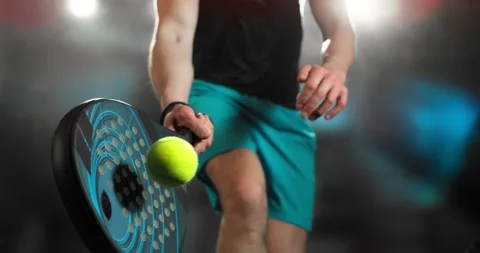 Super slow motion close-up of a padel player hitting a ball with a racket Stock Footage 330530054