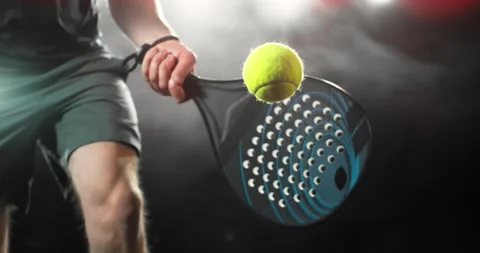 Super slow motion close-up of a padel player hitting a ball with a racket Stock Footage 330542806