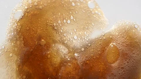 Super slow motion close up of pouring cola into a drinking glass with bubbles Stock Footage 153806794