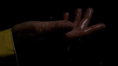 Super Slow Motion Close up Shot of a Woman's Hand Catching Raindrops Stock Footage 270397621