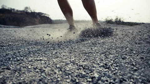 SUPER SLOW MOTION, Close up Trail Running in the rock mountain slide brake Stock-Footage 124352350