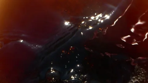 Super slow motion closeup of cola drink splashing with bubbles, drops and foam Stock Footage 153953576