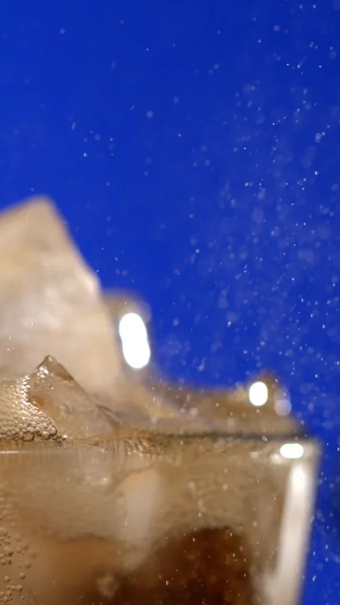 Super slow motion, Closeup Cola Bubbles Over Ice, Cinematic Slowmotion Capture Stock Footage 330273538