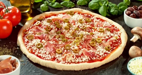 Super slow motion closeup of dried oregano falling onto prepared pizza Stock Footage 328825912