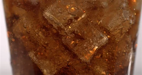 Super slow motion, Closeup Glass Cola Ice Bubbles Rising, Dark Amber Soda Stock Footage 330273580