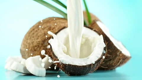 Super Slow Motion of Coconuts With Milk Splash. Stock Footage 247693310