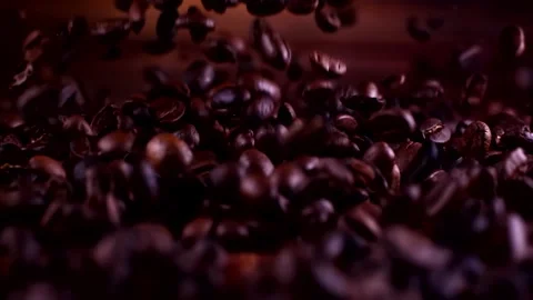 Super slow motion coffee beans falling on a wooden background 1000 fps Stock Footage 130961171