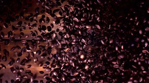 Super slow motion coffee beans falling on a wooden background 1000 fps Stock Footage 130961526