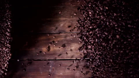 Super slow motion coffee beans falling on a wooden background 1000 fps Stock Footage 130962439