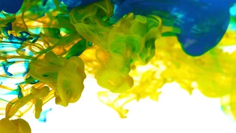 Super slow motion of coloured inks in water. Isolated on white background. Stock Footage 127576530