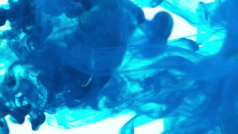Super slow motion of coloured inks in water. Isolated on white background. Stock Footage 127576628