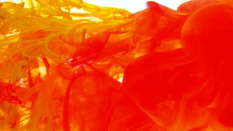 Super slow motion of coloured inks in water. Isolated on white background. Stock Footage 127578123