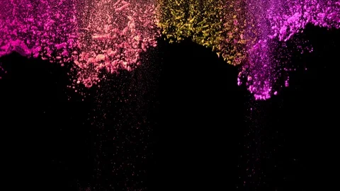 Super slow motion of coloured powder falling on black background. Stock Footage 106003100