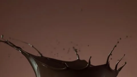Super slow motion of dark hot chocolate splashing. Stock Footage 141282421