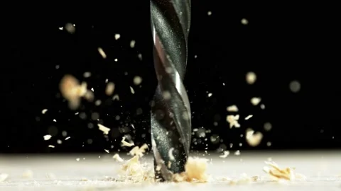 Super slow motion of detail of a drill bit drilling into wood. Video stock 199249172