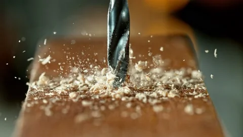 Super slow motion of detail of a drill bit drilling into wood. Stock Footage 199765302