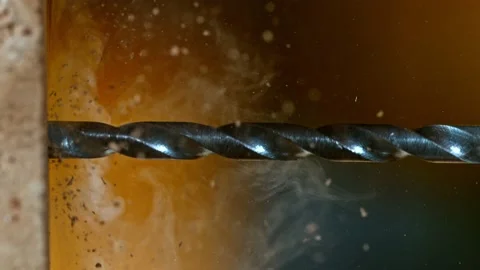 Super slow motion of detail of a drill bit drilling into brick wall. Stock Footage 199767171