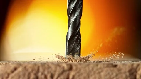 Super slow motion of detail of a drill bit drilling into brick wall. Stock Footage 248040537