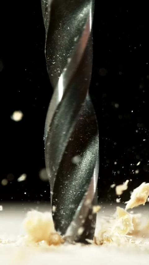 Super slow motion of detail of a drill bit drilling into wood. Stock Footage 308371230