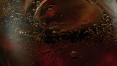 Super Slow Motion Detail Shot of Waving Cola Lemonade Background at 1000fps. Stock Footage 327687748