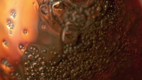 Super Slow Motion Detail Shot of Waving Cola Lemonade Background at 1000fps. Stock Footage 334969961