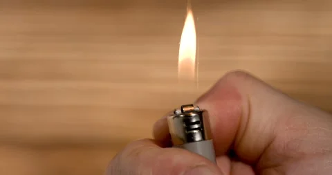 Super Slow Motion Detailed Shot Of Hand Striking Lighter With Flame In Slow Stock Footage 334079422