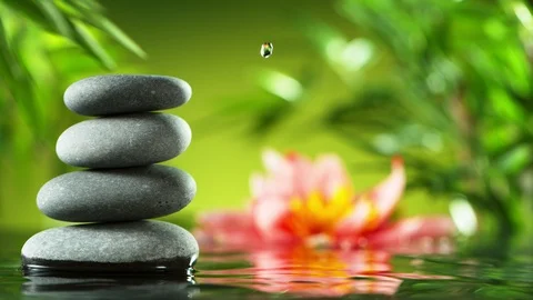 Super slow motion of dripping drops into water, spa and wellness concept. Stock Footage 124395227