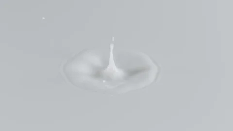 Super slow motion of dripping milk drop filmed with macro lens. Stock Footage 99445269