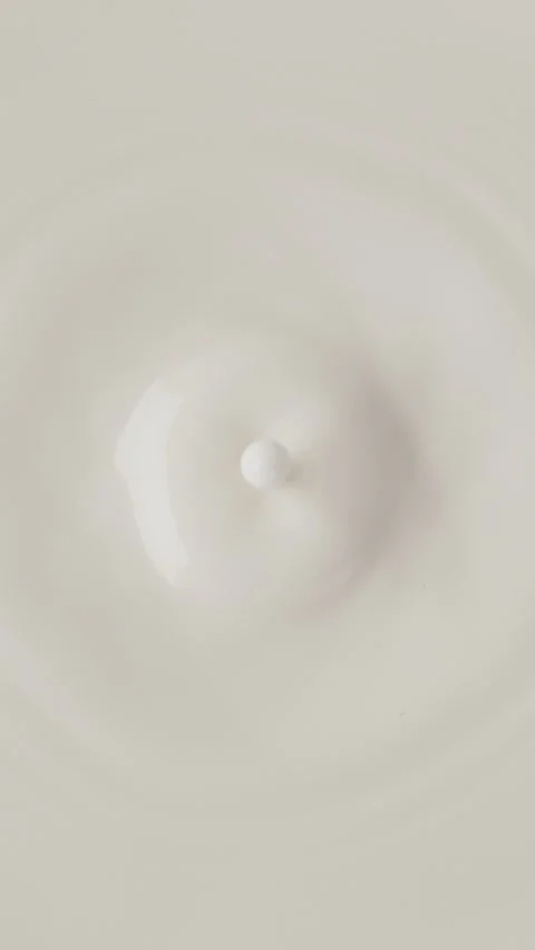 Super slow motion of dripping milk drop, top view. Stock Footage 296477209